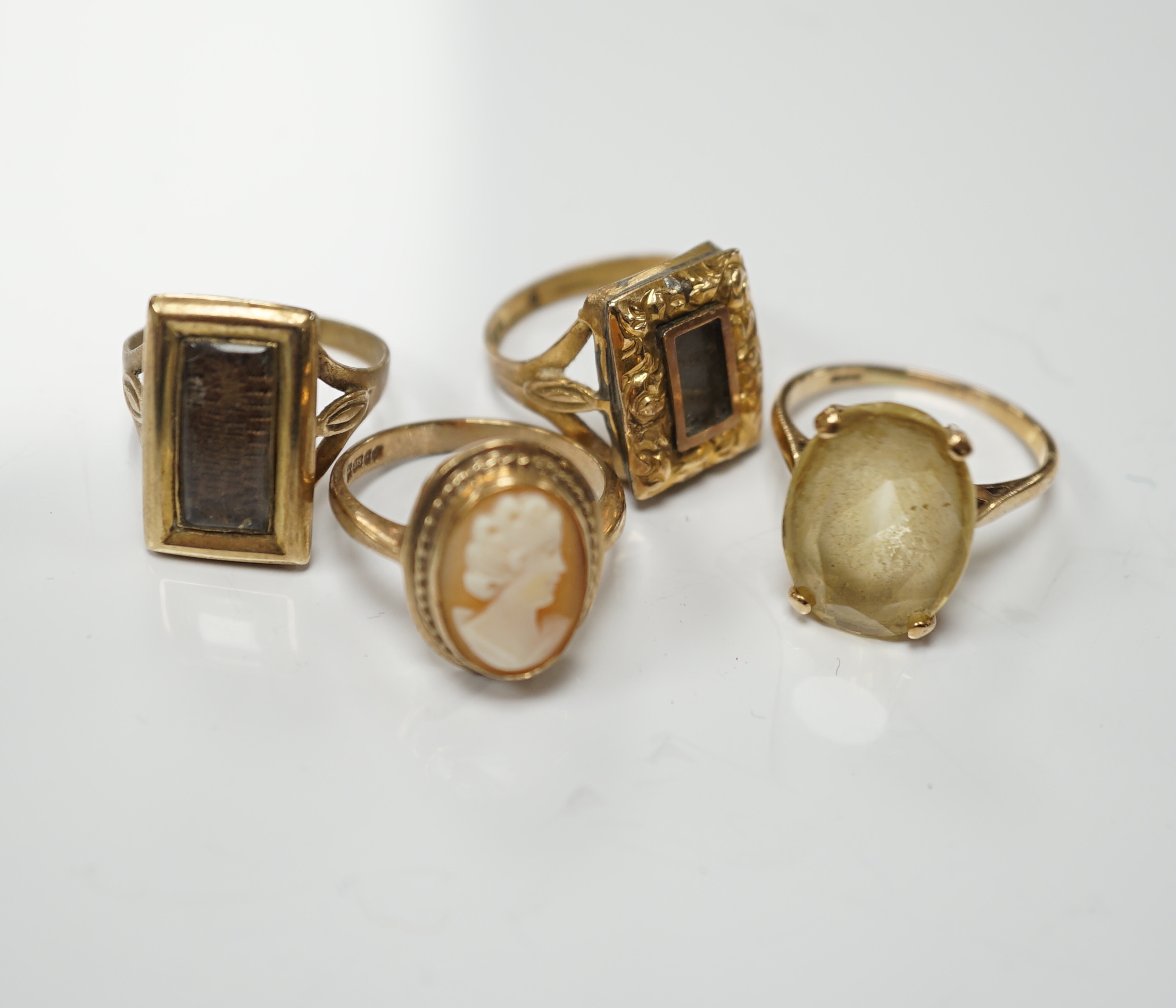 Two 19th century yellow metal mourning brooches, now with shanks converted to dress rings and two other 9ct rings.